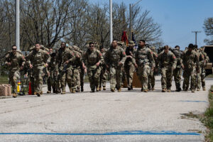 Soldiers marching in military formation.
