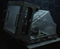 Ruggedized mission computer with transparent side panel showing internal components, metal frame, and integrated display for harsh environments